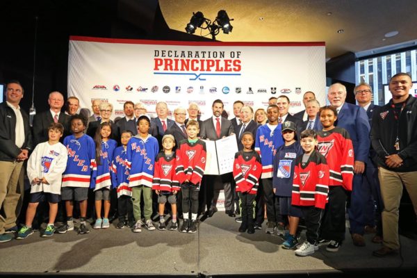 NEW YORK, NY - SEPTEMBER 06:  Members of the 17 leading hockey organizations and select youth hockey players join NHL Commissioner Gary Bettman for a posed photo with the signed Declaration of Principles during the NHL Declaration of Principles in NYC press conference at Del Friscos on September 6, 2017 in New York City. (Photo by Jared Silber/NHLI via Getty Images)